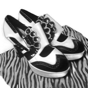 Black and white brass knuckles heels